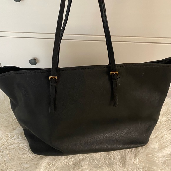 Black leather Michael Kors tote bag with gold-toned accents and flat handles. - Picture 6 of 12